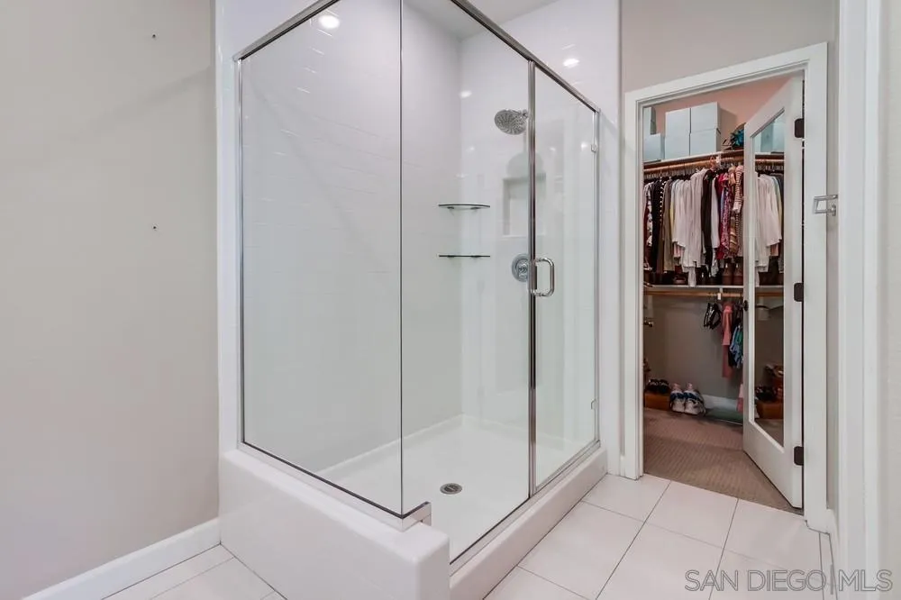 1933 Pascal Court Escondido, CA 92026 - Photo 29 of 52 a bathroom with a shower and a glass door