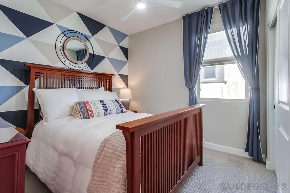 1933 Pascal Court Escondido, CA 92026 - Photo 30 of 52 a bedroom with a bed and a large window