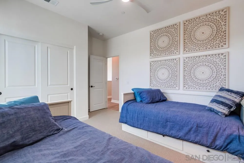 1933 Pascal Court Escondido, CA 92026 - Photo 35 of 52 a bedroom with a large bed and closet