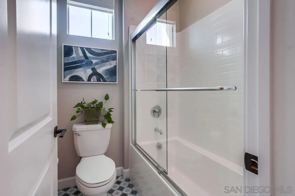 1933 Pascal Court Escondido, CA 92026 - Photo 38 of 52 a bathroom with a toilet a sink and bathtub