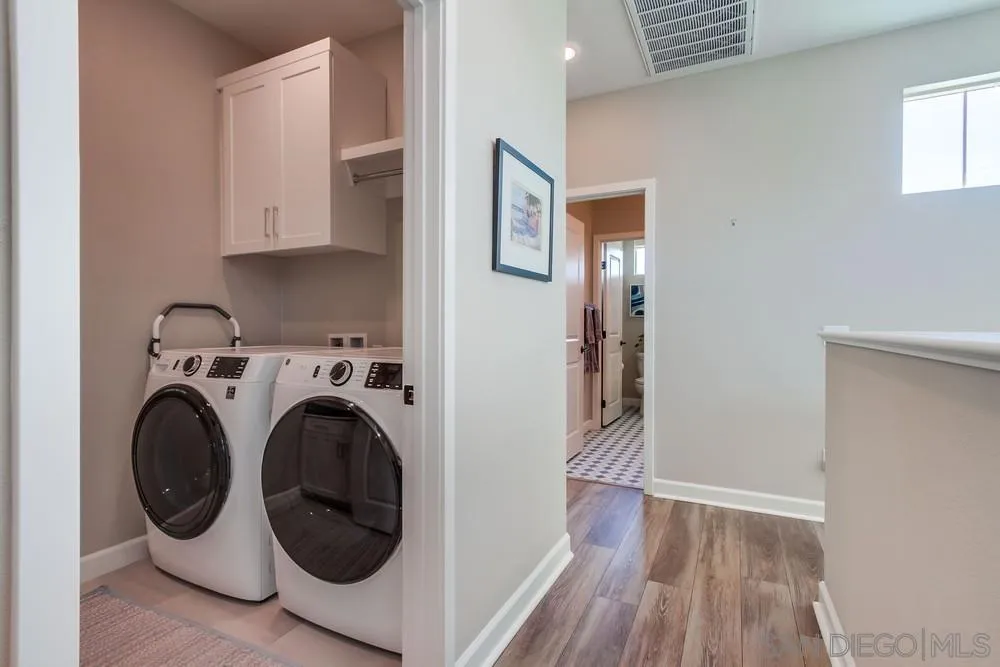 1933 Pascal Court Escondido, CA 92026 - Photo 39 of 52 a view of a hallway with washer and dryer