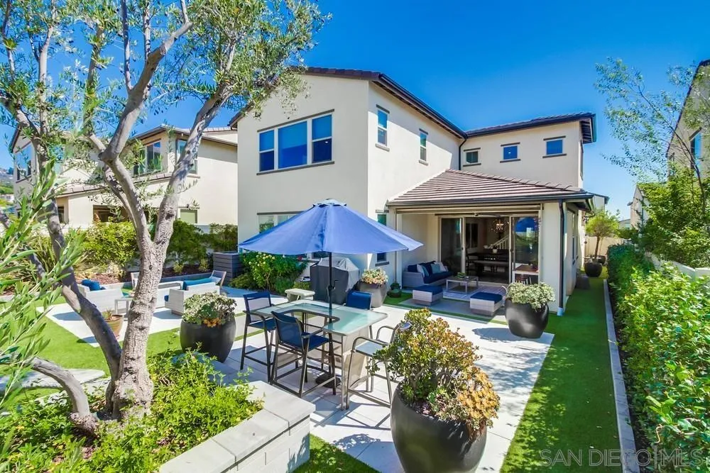 1933 Pascal Court Escondido, CA 92026 - Photo 45 of 52 a view of a house with backyard sitting area and garden