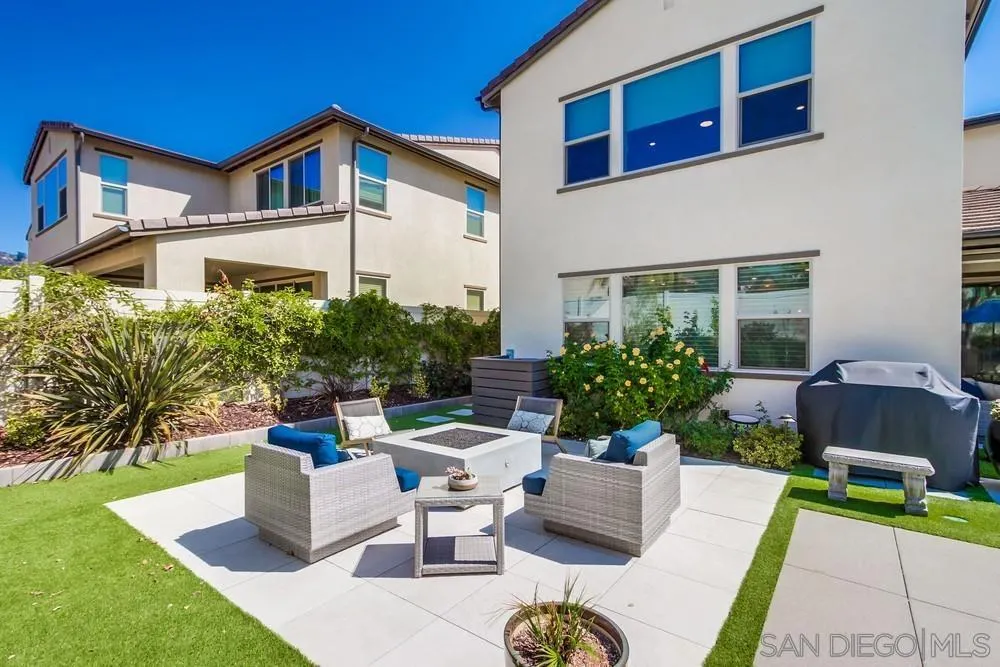1933 Pascal Court Escondido, CA 92026 - Photo 50 of 52 a view of a patio with couches table and chairs and potted plants