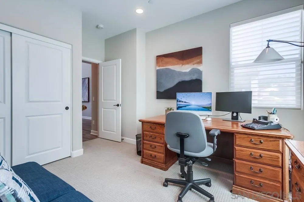 1933 Pascal Court Escondido, CA 92026 - Photo 7 of 52 a view of a workspace with furniture and a window