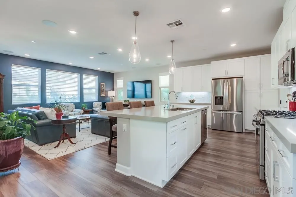 1933 Pascal Court Escondido, CA 92026 - Photo 8 of 52 a kitchen with counter top space a sink appliances and cabinets