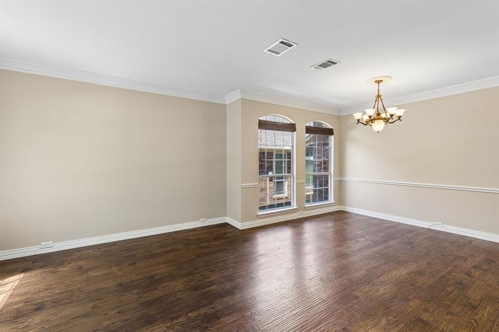 2925 Sunset Ridge McKinney, TX 75072 - Photo 4 of 33 Elegant formal dining room highlighted by gorgeous nailed-down hardwood floors, crown molding, abundant natural light, and ample space for hosting memorable dinners and gatherings.