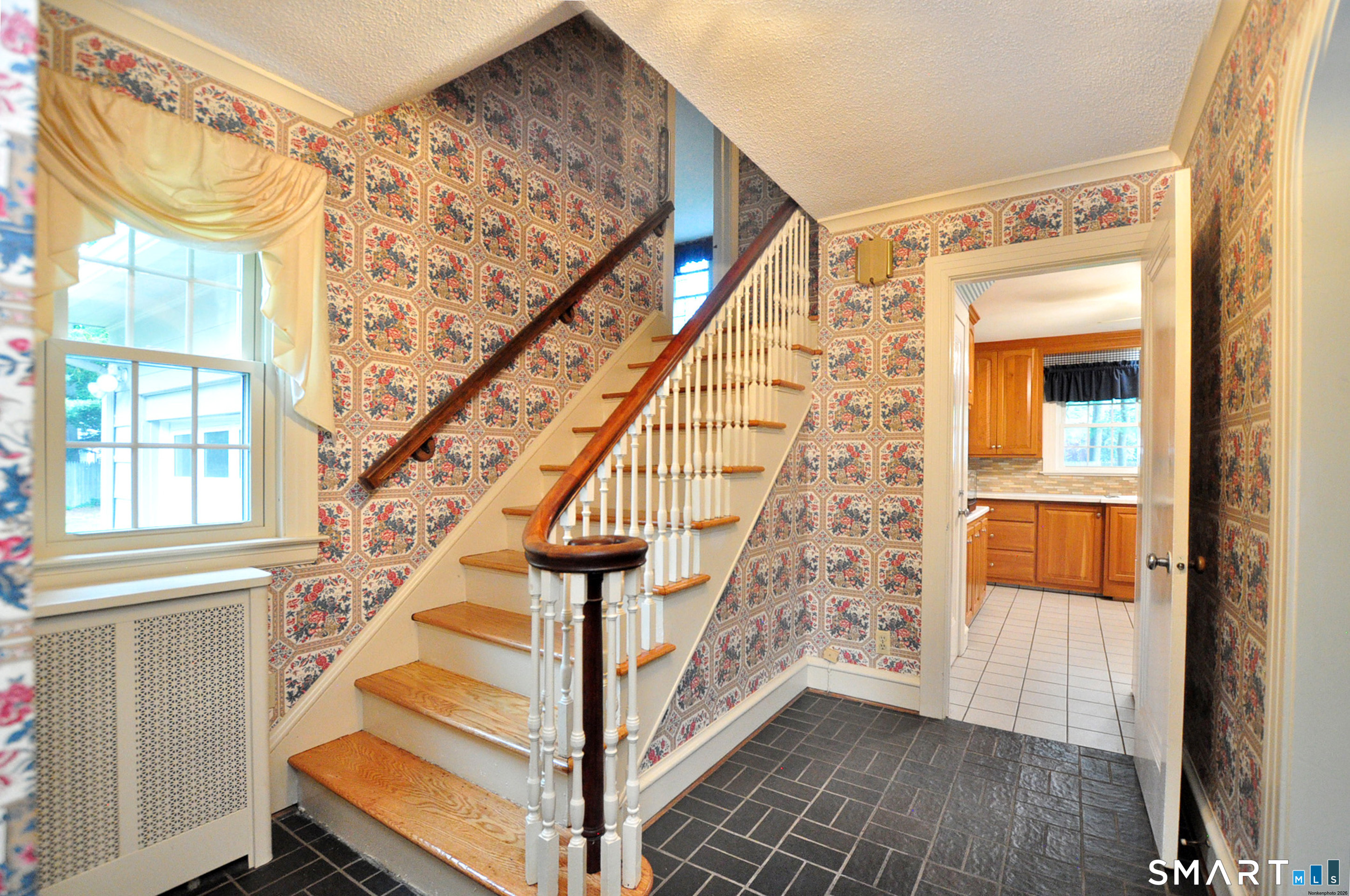 10 Harvey Road Windsor, CT 06095 - Photo 16 of 36 a view of entryway with wooden floor and stairs