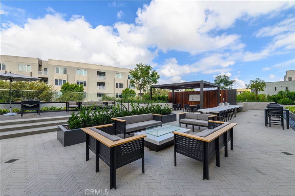 3608 Rivington Irvine, CA 92612 - Photo 59 of 74 a view of a patio with couches and a table and chairs with potted plants