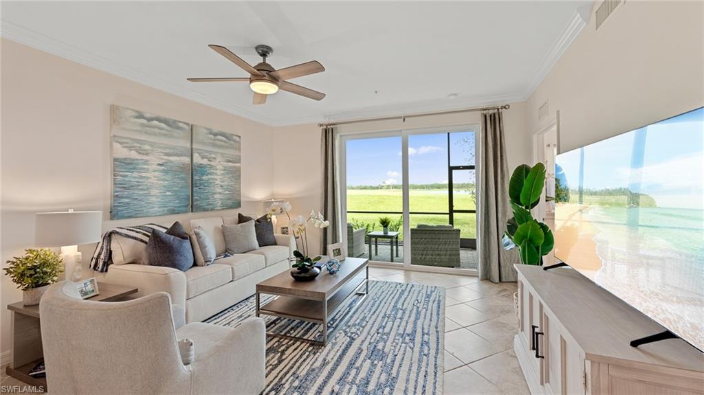 5467 Double Eagle Circle, Unit 3225 Ave Maria, FL 34142 - Photo 11 of 31 a living room with furniture and a large window