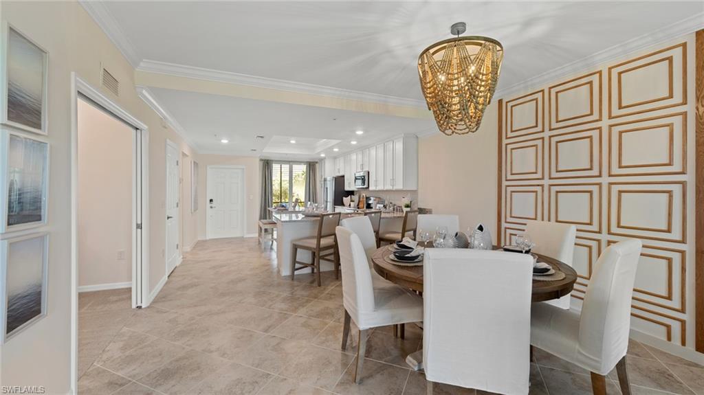 5467 Double Eagle Circle, Unit 3225 Ave Maria, FL 34142 - Photo 12 of 31 a view of dining room and livingroom with furniture
