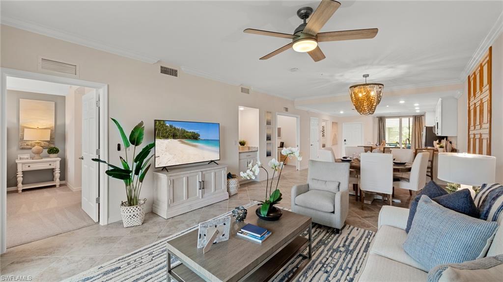 5467 Double Eagle Circle, Unit 3225 Ave Maria, FL 34142 - Photo 14 of 31 a living room with furniture potted plant and a large window