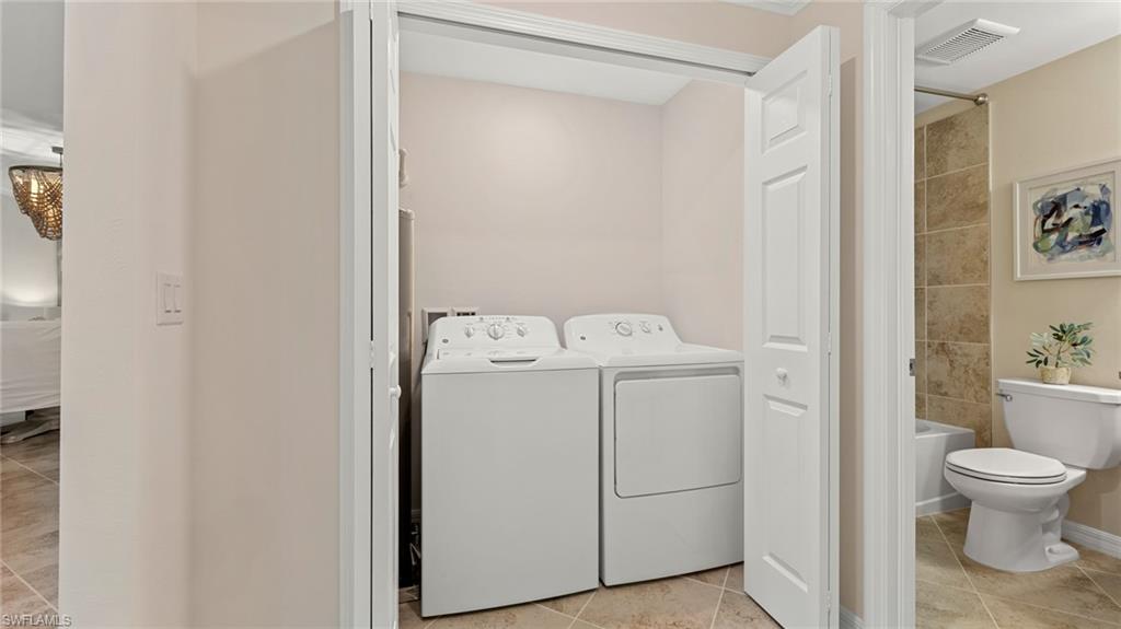 5467 Double Eagle Circle, Unit 3225 Ave Maria, FL 34142 - Photo 21 of 31 a view of bathroom with a washer and dryer