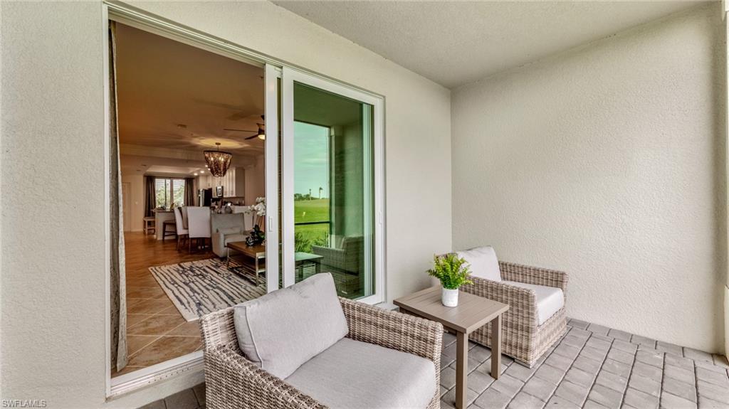5467 Double Eagle Circle, Unit 3225 Ave Maria, FL 34142 - Photo 23 of 31 a view of a workspace with furniture and front door