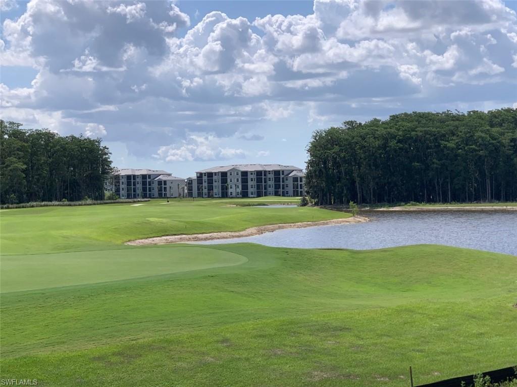5467 Double Eagle Circle, Unit 3225 Ave Maria, FL 34142 - Photo 25 of 31 a view of swimming pool is middle in the middle of a yard
