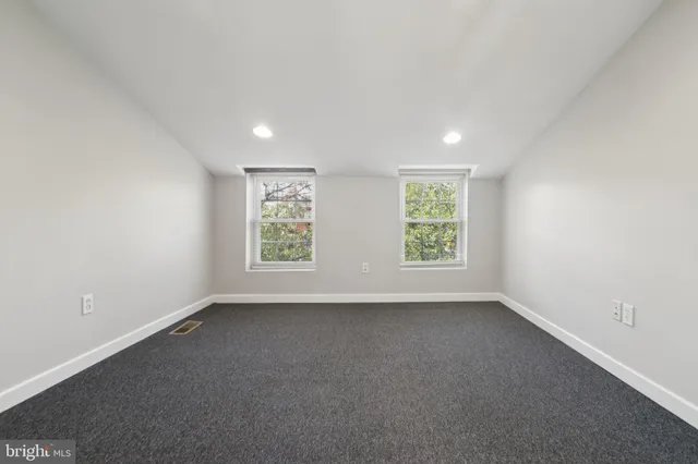 a bathroom with a tub shower and vanity