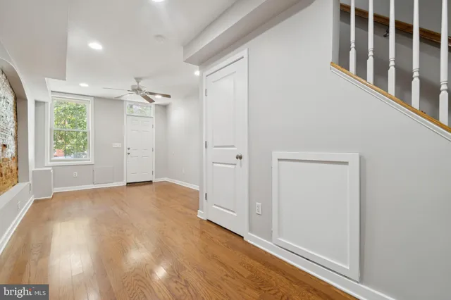 a view of a brick house with a yard