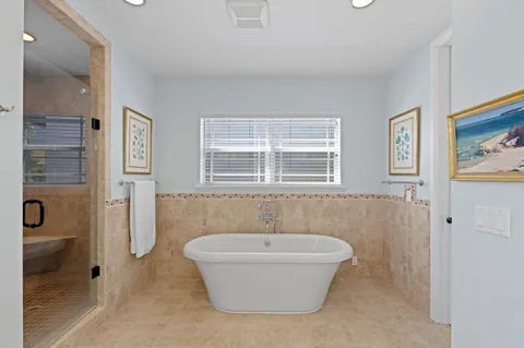 a bathroom with a bathtub and shower