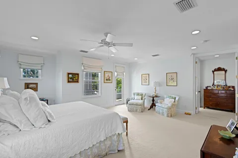 a bedroom with a large bed and a couch