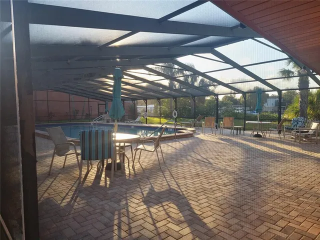 a view of a swimming pool with a patio