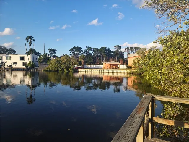 a view of a balcony with wooden floor