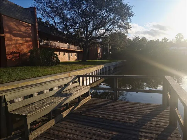a view of a lake with houses in the back