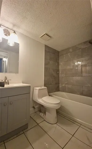 a bathroom with a toilet a sink and bathtub