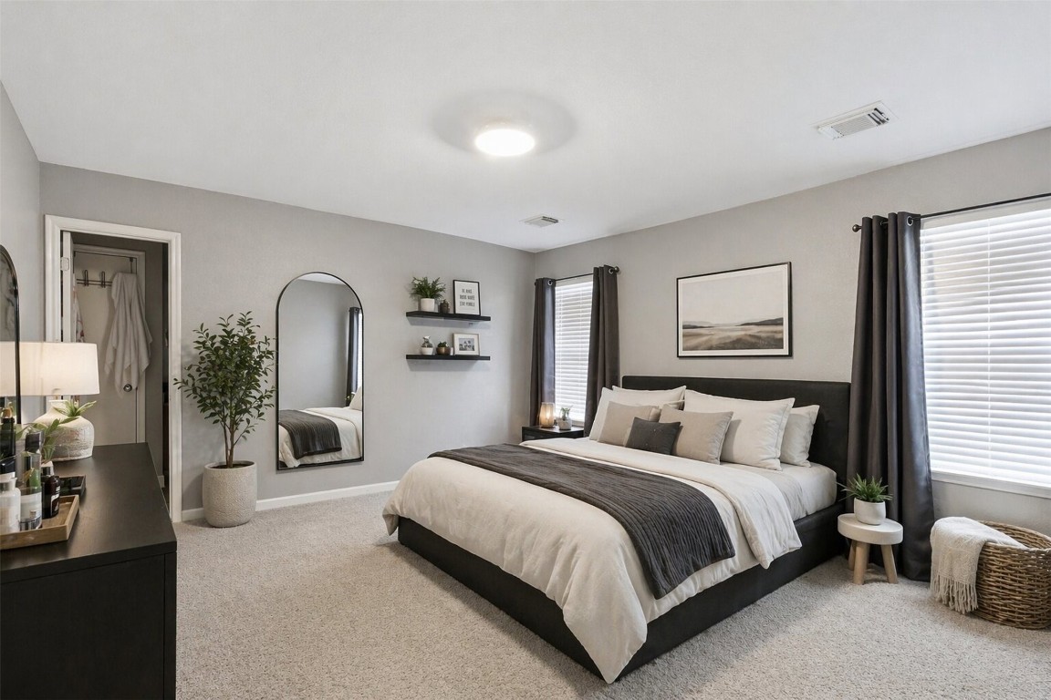 3010 Swift Brook Glen Way Spring, TX 77389 - Photo 11 of 17 a bedroom with a large bed and a potted plant