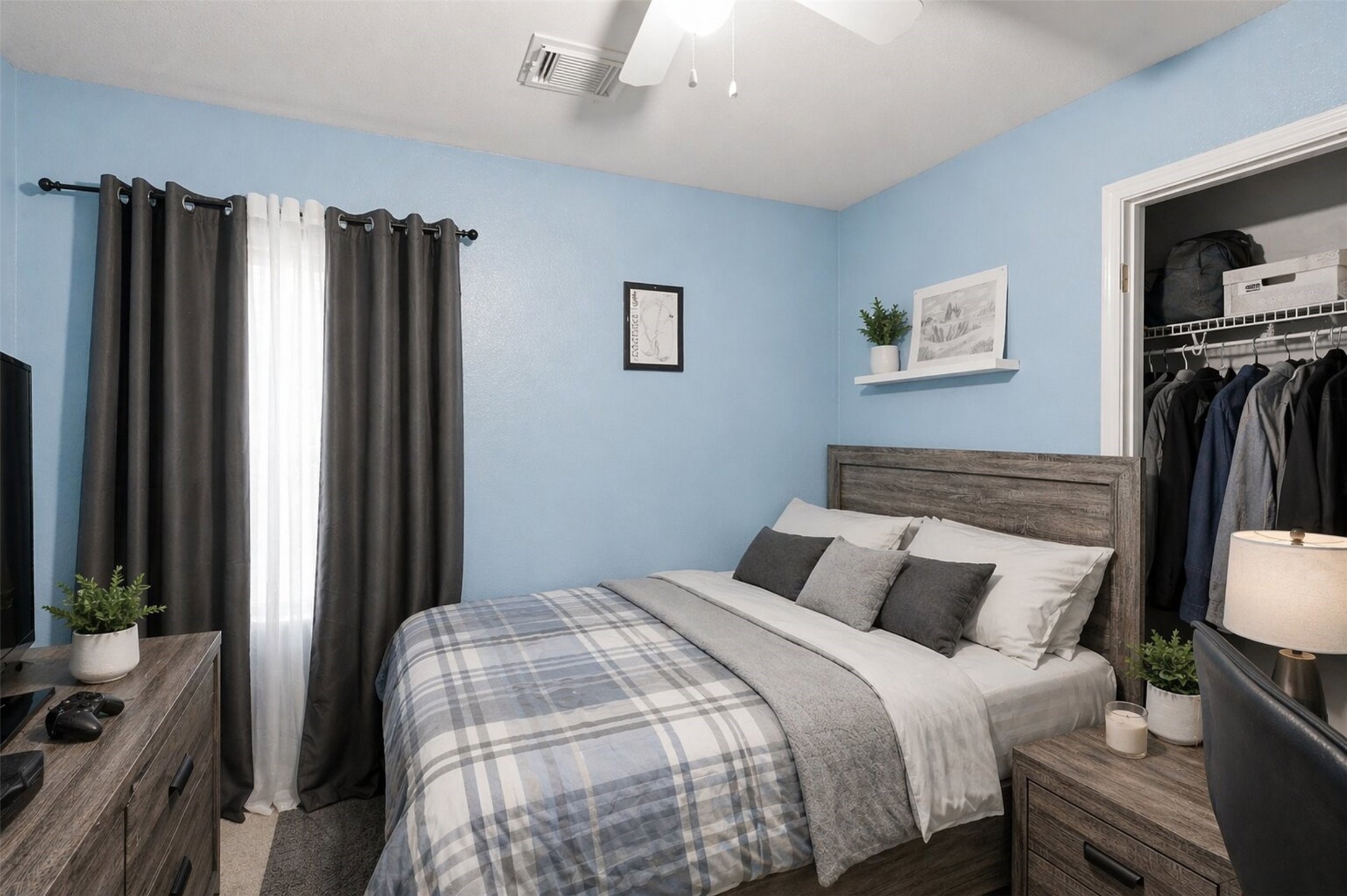 3010 Swift Brook Glen Way Spring, TX 77389 - Photo 13 of 17 a bedroom with a bed and a flat screen tv