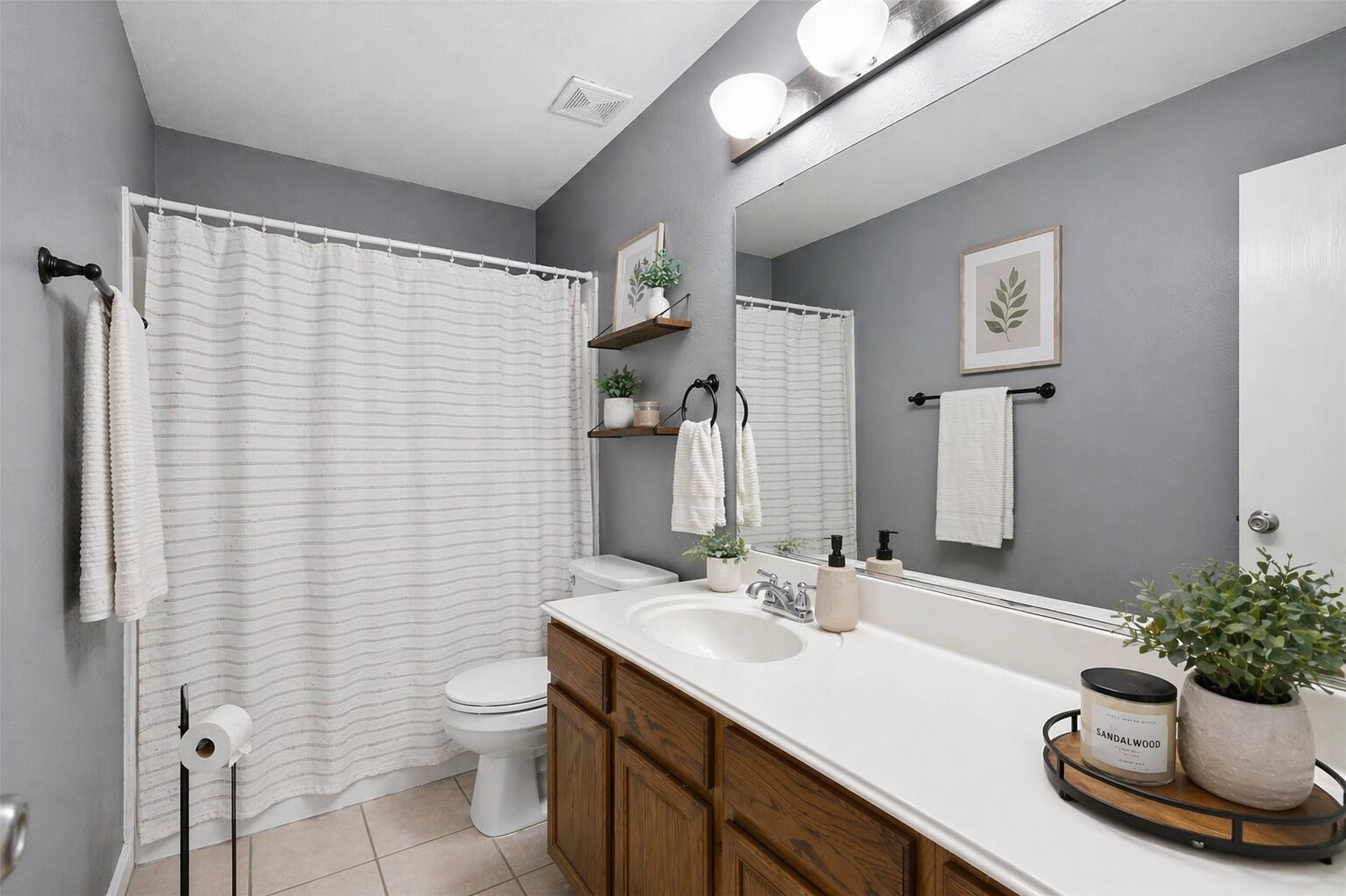 3010 Swift Brook Glen Way Spring, TX 77389 - Photo 15 of 17 a bathroom with a sink a toilet and mirror