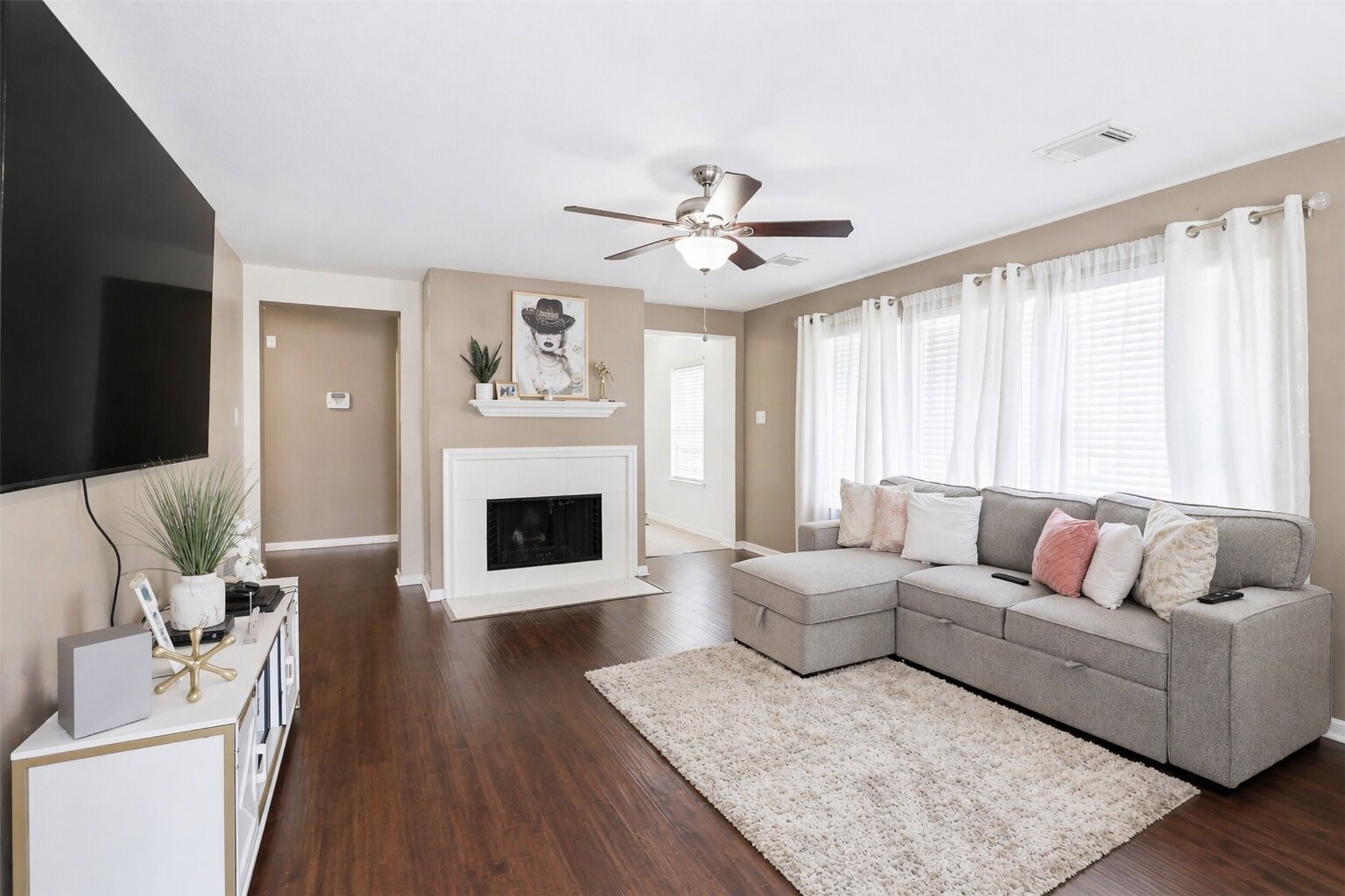 3010 Swift Brook Glen Way Spring, TX 77389 - Photo 3 of 17 a living room with furniture a fireplace and a large window