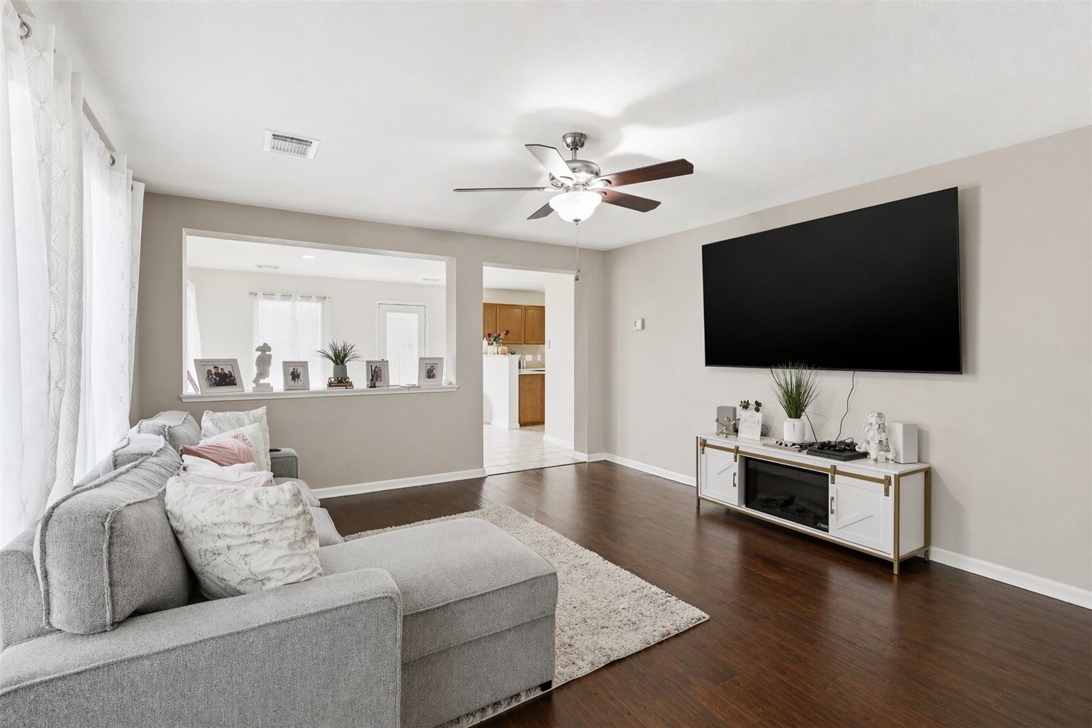 3010 Swift Brook Glen Way Spring, TX 77389 - Photo 4 of 17 a living room with furniture and a flat screen tv
