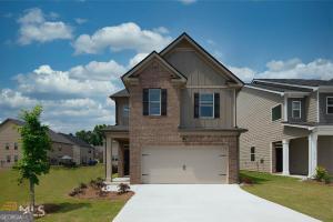 11922 Lovejoy Crossing Way Hampton, GA 30228 - Photo 1 of 15 a front view of a house with a yard