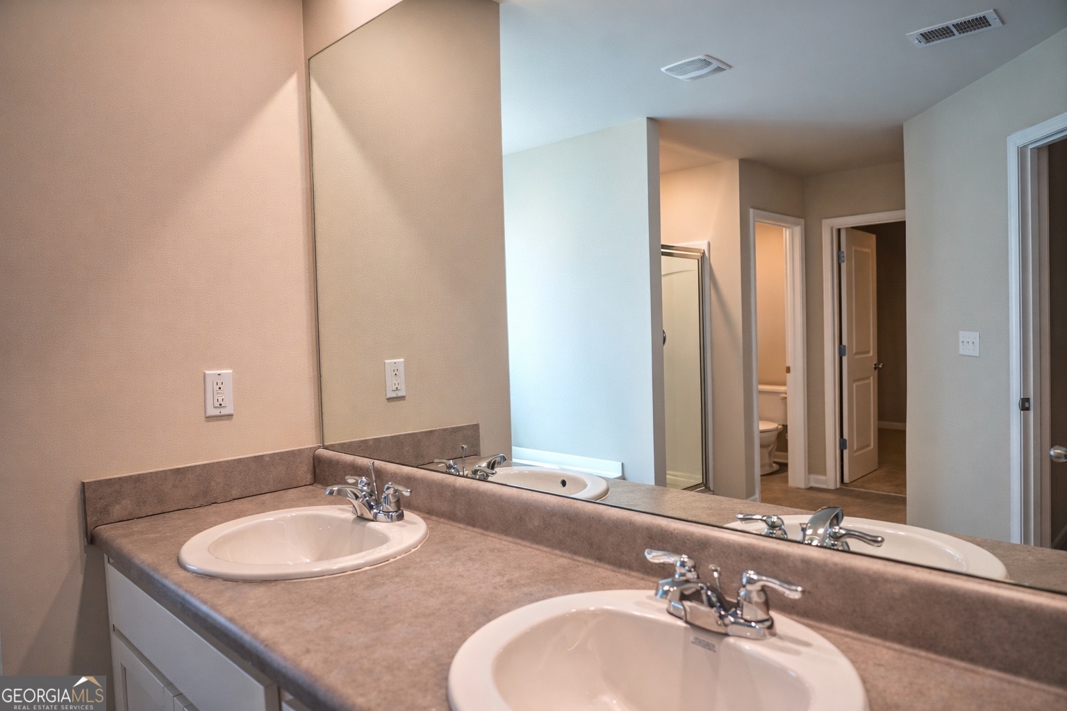 11922 Lovejoy Crossing Way Hampton, GA 30228 - Photo 11 of 15 a bathroom with a sink and a mirror