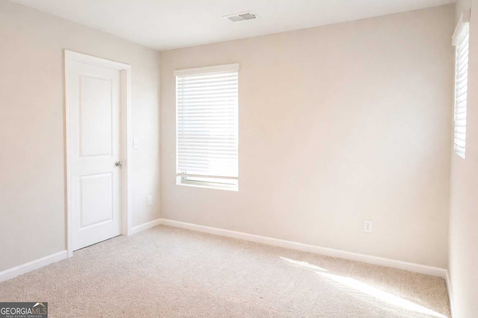 11922 Lovejoy Crossing Way Hampton, GA 30228 - Photo 12 of 15 an empty room with a window