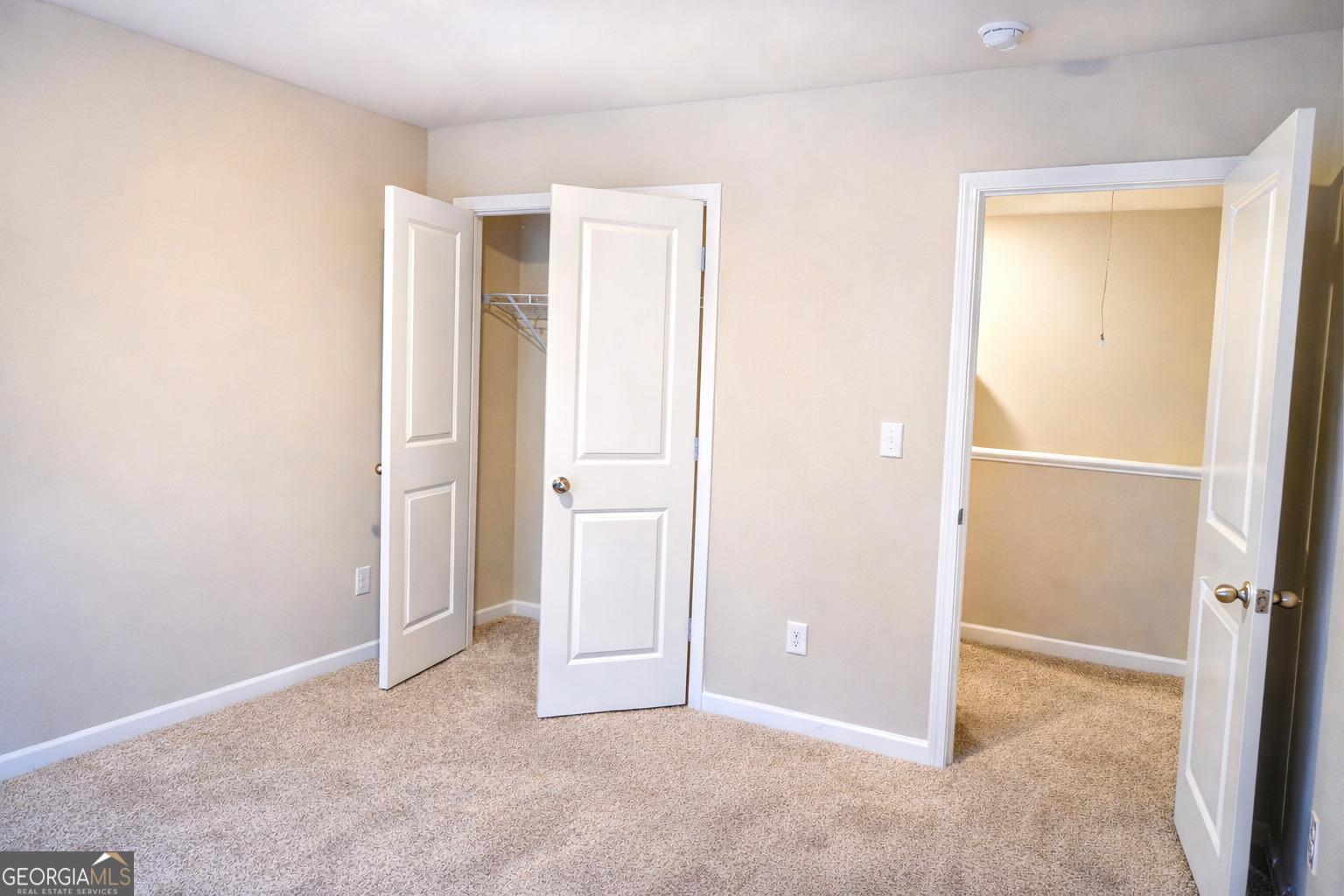 11922 Lovejoy Crossing Way Hampton, GA 30228 - Photo 15 of 15 an empty room with closet and a bathroom