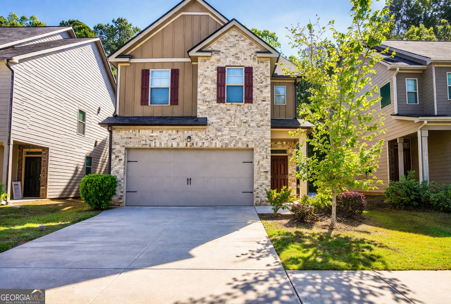 11922 Lovejoy Crossing Way Hampton, GA 30228 - Photo 2 of 15 a front view of a house with garden