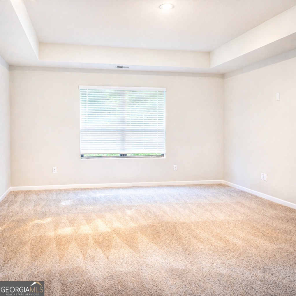 11922 Lovejoy Crossing Way Hampton, GA 30228 - Photo 7 of 15 an empty room with a window