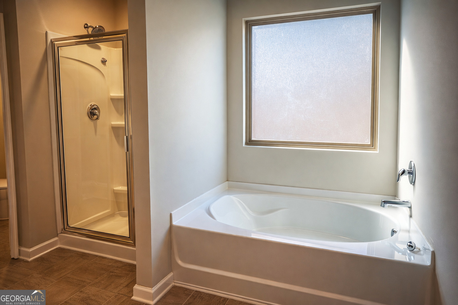 11922 Lovejoy Crossing Way Hampton, GA 30228 - Photo 8 of 15 a white bath tub sitting next to a shower