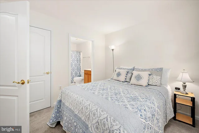 a bedroom with a bed and a cabinets