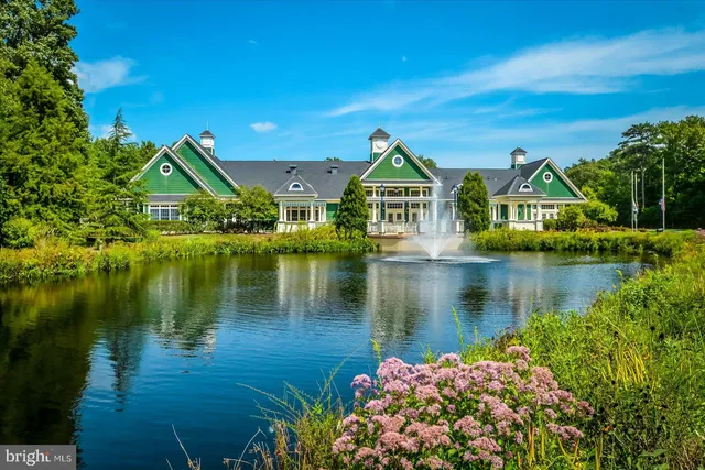 a view of a town with river and houses