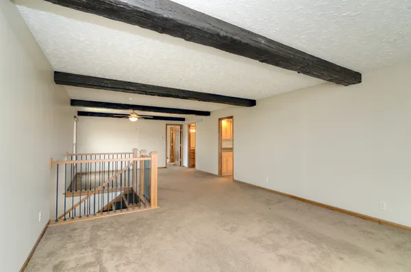 a large kitchen with cabinets and stainless steel appliances