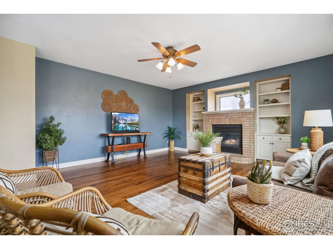 1618 Silvergate Road Fort Collins, CO 80526 - Photo 17 of 37 Love this family room, the floors and fireplace make this a space you will love to live in !