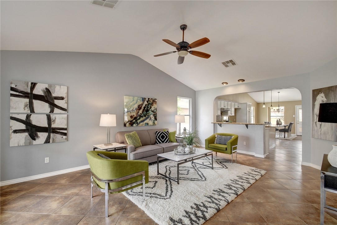 720 Sampson Kyle, TX 78640 - Photo 1 of 1 a living room with furniture and a wooden floor
