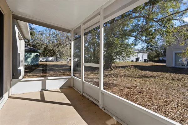 a view of a porch with a large window