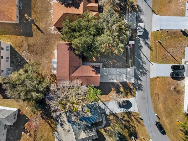 an aerial view of a house with swimming pool