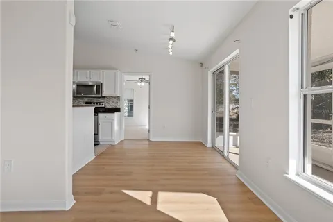 a kitchen with stainless steel appliances a refrigerator and a stove top oven