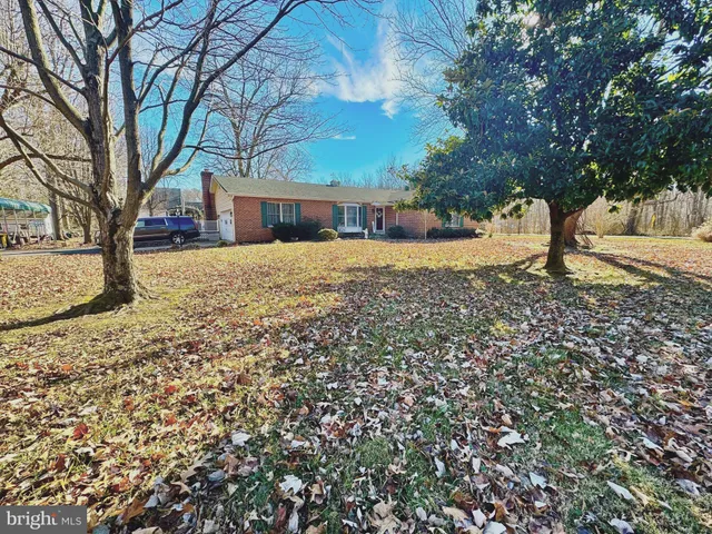 a house with trees in front of it