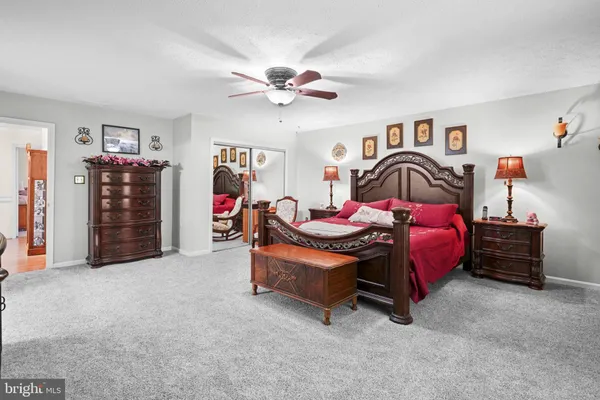 a bedroom with furniture and a chandelier