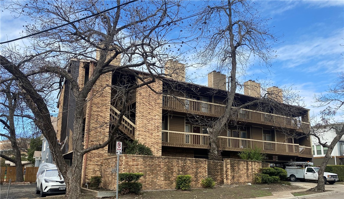 612 Park Place, Unit 303 Austin, TX 78705 - Photo 1 of 26 a front view of a building with streets and trees