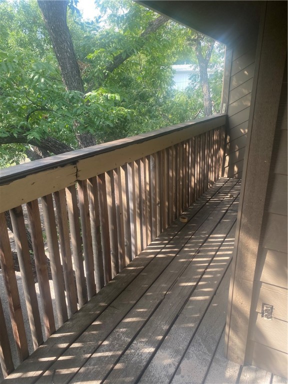 612 Park Place, Unit 303 Austin, TX 78705 - Photo 21 of 26 a balcony with wooden floor